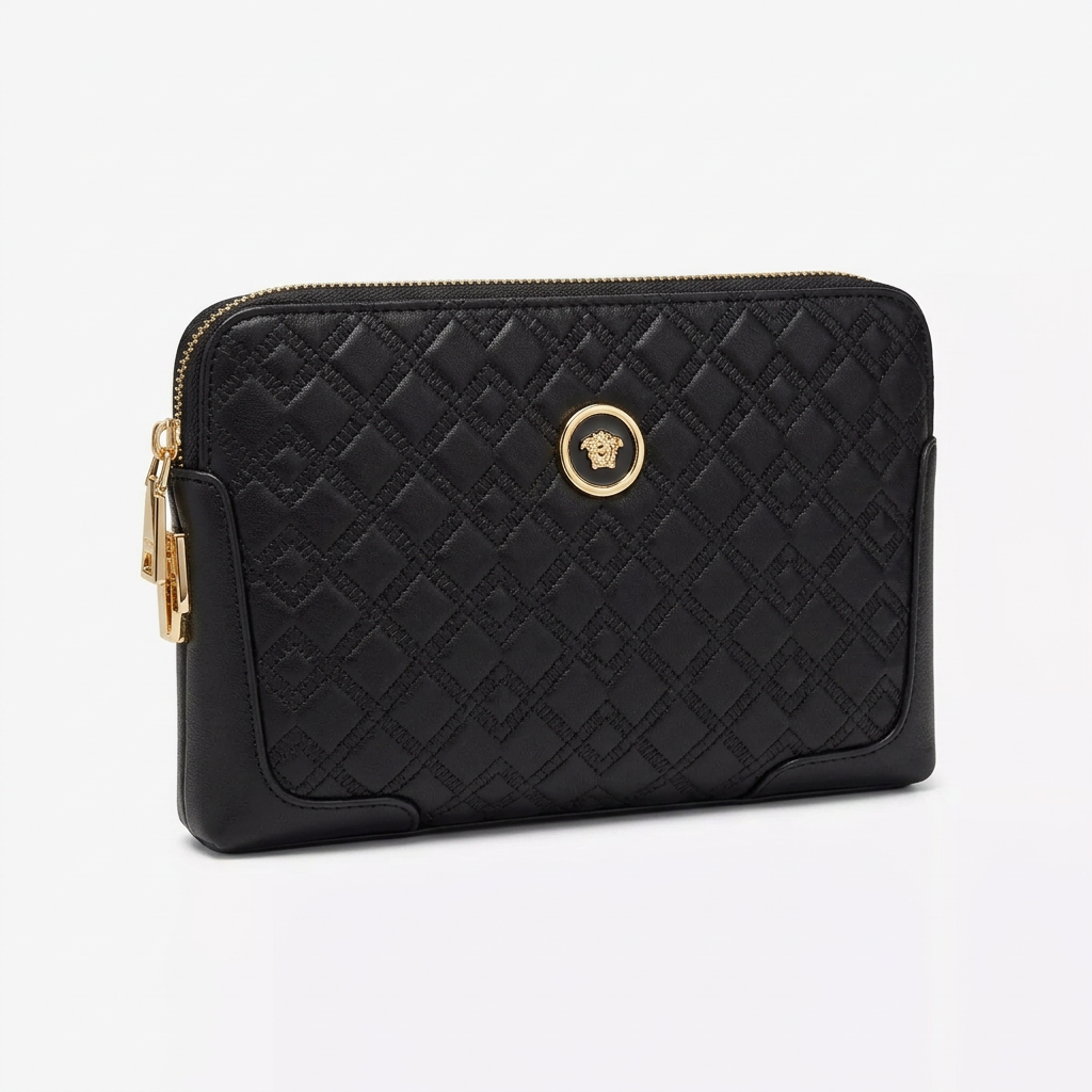 Individual subtly patterned black pouch with small circular gold-tone badge