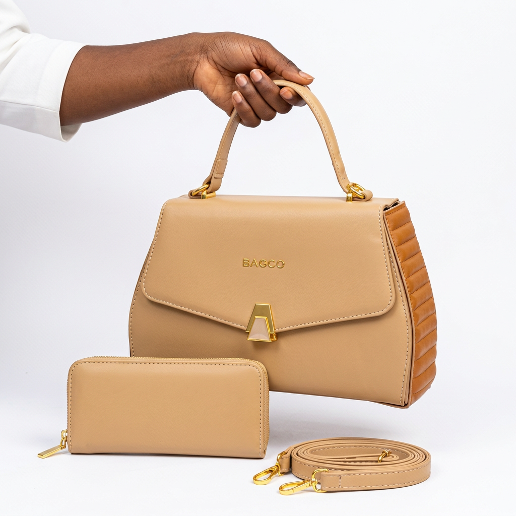 Hand holding a beige handbag with caramel ribbed sides and matching accessories