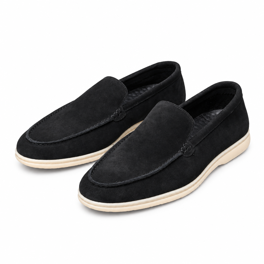 Pair of black suede summer walk loafers on white background