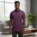Young Nigerian male model wearing burgundy contrast collar polo shirt, front view