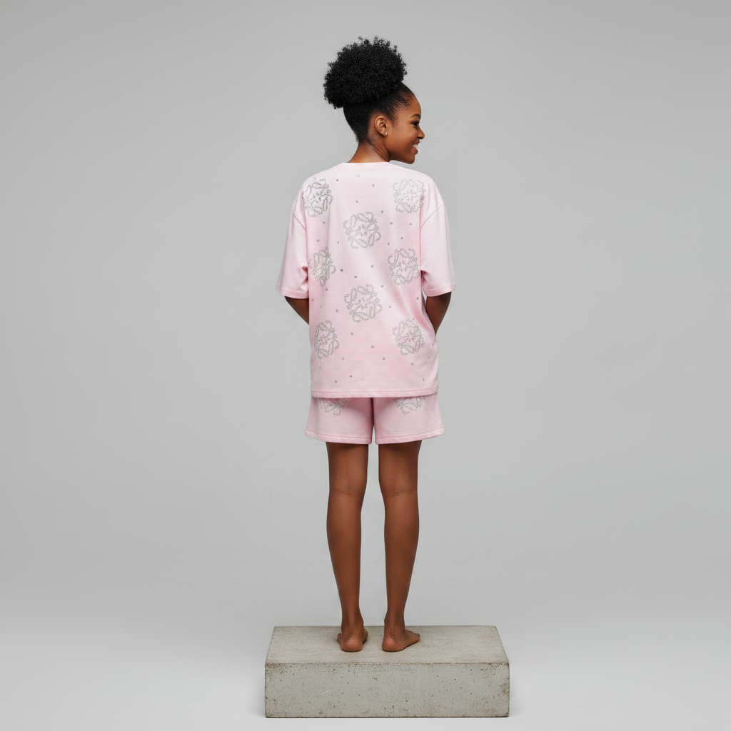 Nigerian female model back view - pink rhinestone top and shorts set
