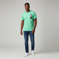 Young Nigerian male wearing bright mint green Authentic box logo graphic crew neck tee