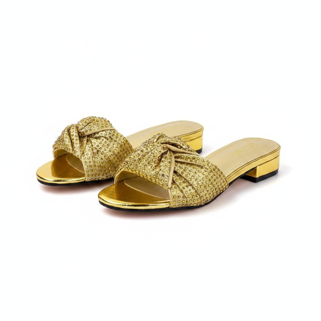 Ghost mannequin pair view of gold rhinestone bow block heel slide mules