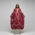 Nigerian female model wearing Burgundy Adire Bird Print Hooded Long Bubu Gown