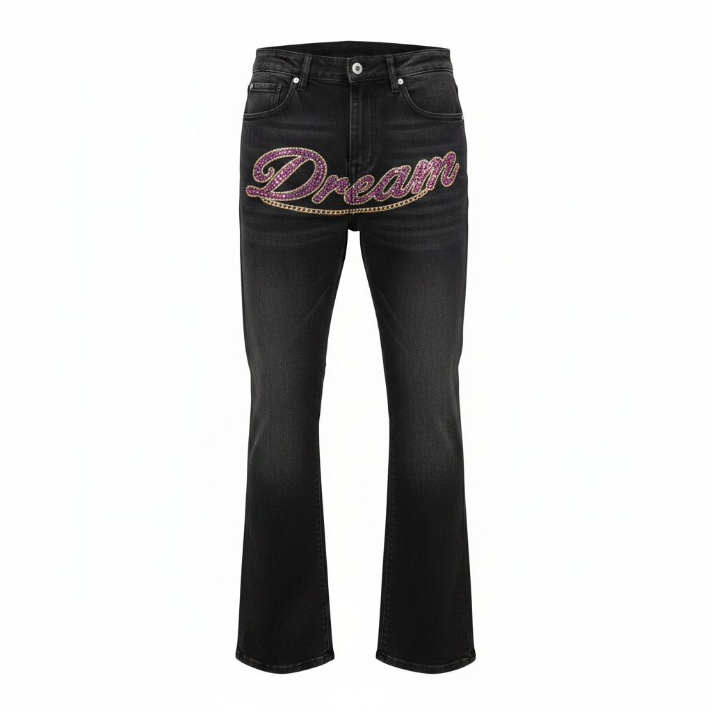 Men's black flared denim jeans with pink rhinestone cursive script and gold chain outline, ghost mannequin front view