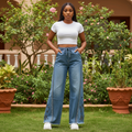 Women's blue high-waist wide-leg jeans with rhinestone side stripe and charm detail — Nigerian female model lifestyle shot