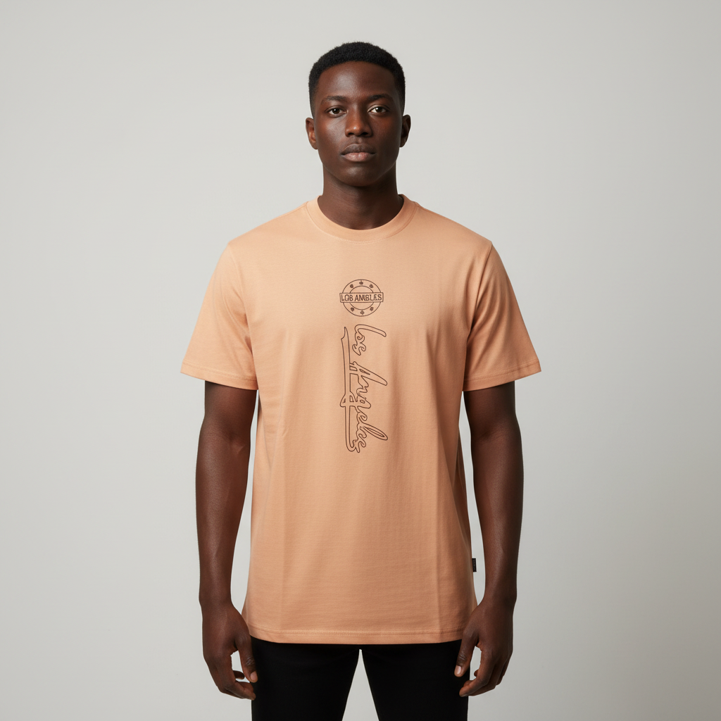Black Nigerian male model wearing a beige Los Angeles graphic T-shirt