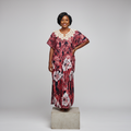 Nigerian female model wearing Wine Adire Long Bubu Gown with cream crochet lace neckline