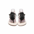 Women's white flat T-strap sandals with black chiffon flower ghost mannequin pair view