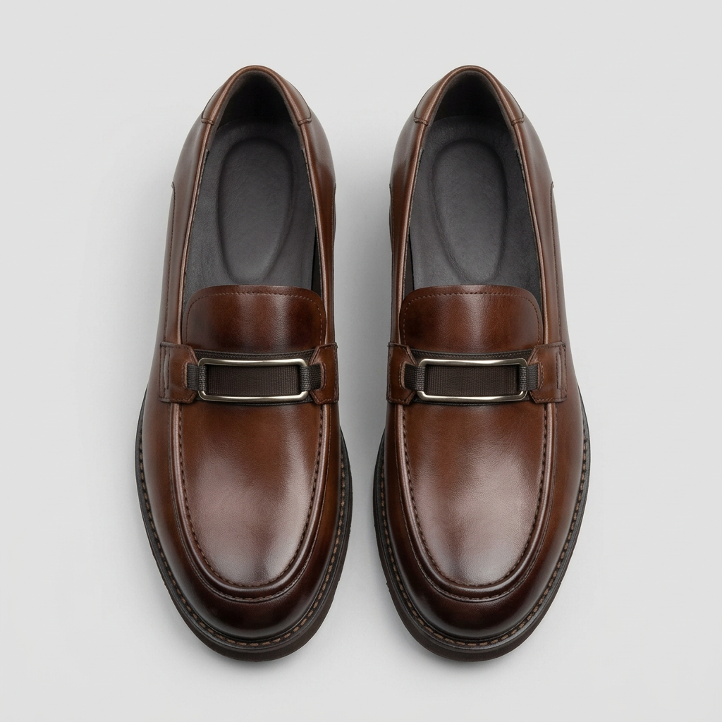 Men's brown leather loafers with metal buckle trim, front view