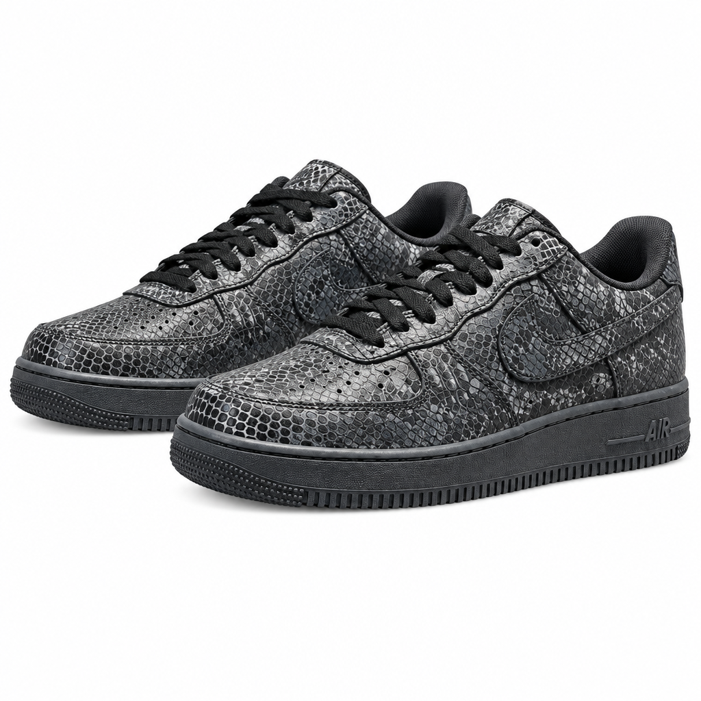 Pair of charcoal snakeskin-effect low-top sneakers on white