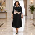 One woman wearing the black contrast-collar pleated occasion dress