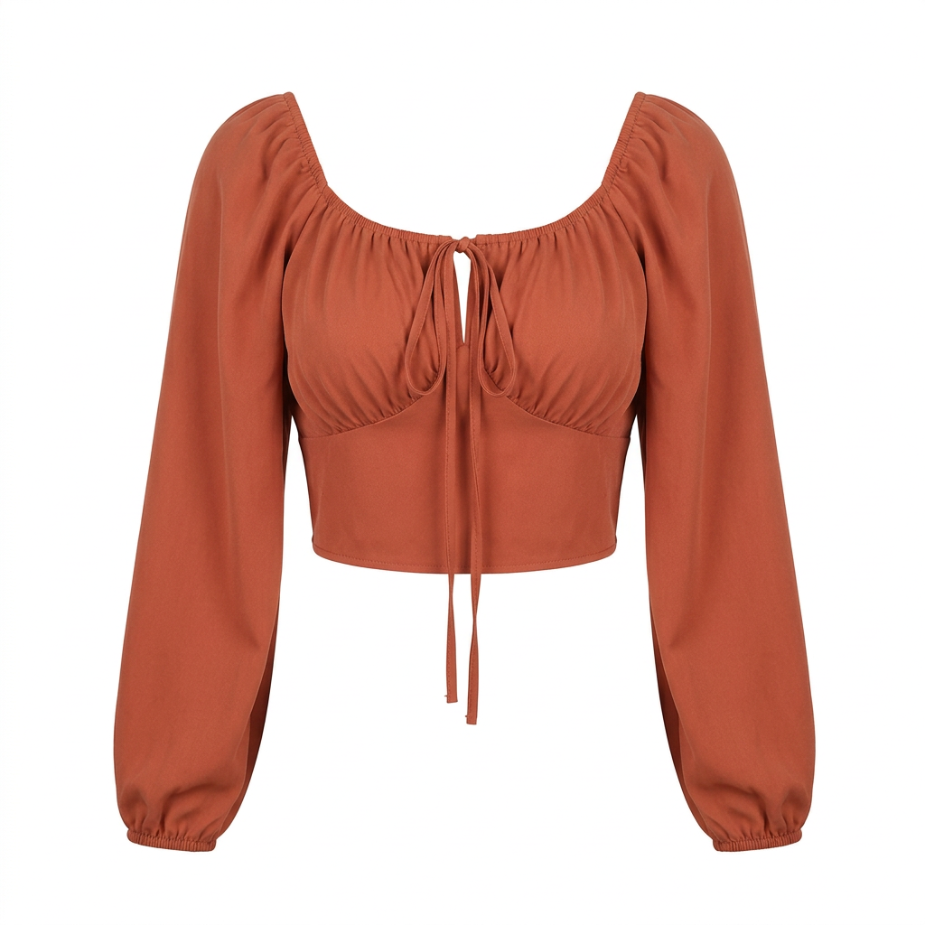 Rust-orange cropped tie-front blouse with long puff sleeves on an invisible mannequin