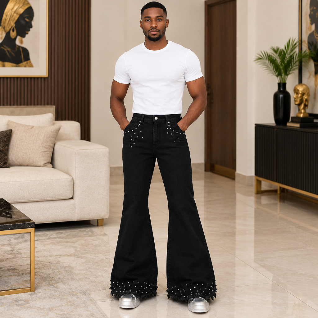 Man wearing black flare trousers with silver stud details