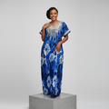 Nigerian female model wearing Blue Adire Long Bubu Gown with gold sequin neckline