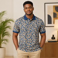 Young Black Nigerian man wearing navy blue botanical leaf print polo shirt