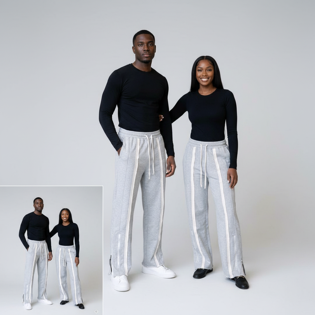 African Nigerian couple wearing unisex grey wide-leg jogger trousers with white stripe panels