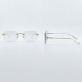 Front and side views of gold-tone rimless eyeglasses