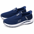 Pair of navy knit-look slip-on sneakers on white
