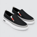 Black textured slip-on shoes with grey trim and white platform soles