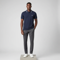 Nigerian male model wearing navy blue contrast-tipped polo shirt, front view