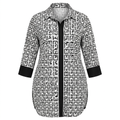 Black-and-white geometric longline blouse with black cuffs on an invisible mannequin against white