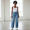 Nigerian female model wearing light blue wide-leg high-waist jeans front view