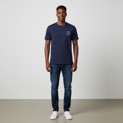 Young Nigerian male wearing deep navy Outfitters Spirit Within circular badge graphic crew neck tee