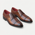 Pair of brown men's lace-up cap-toe shoes