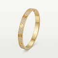 Gold-colour pave stone screw-detail bracelet on white