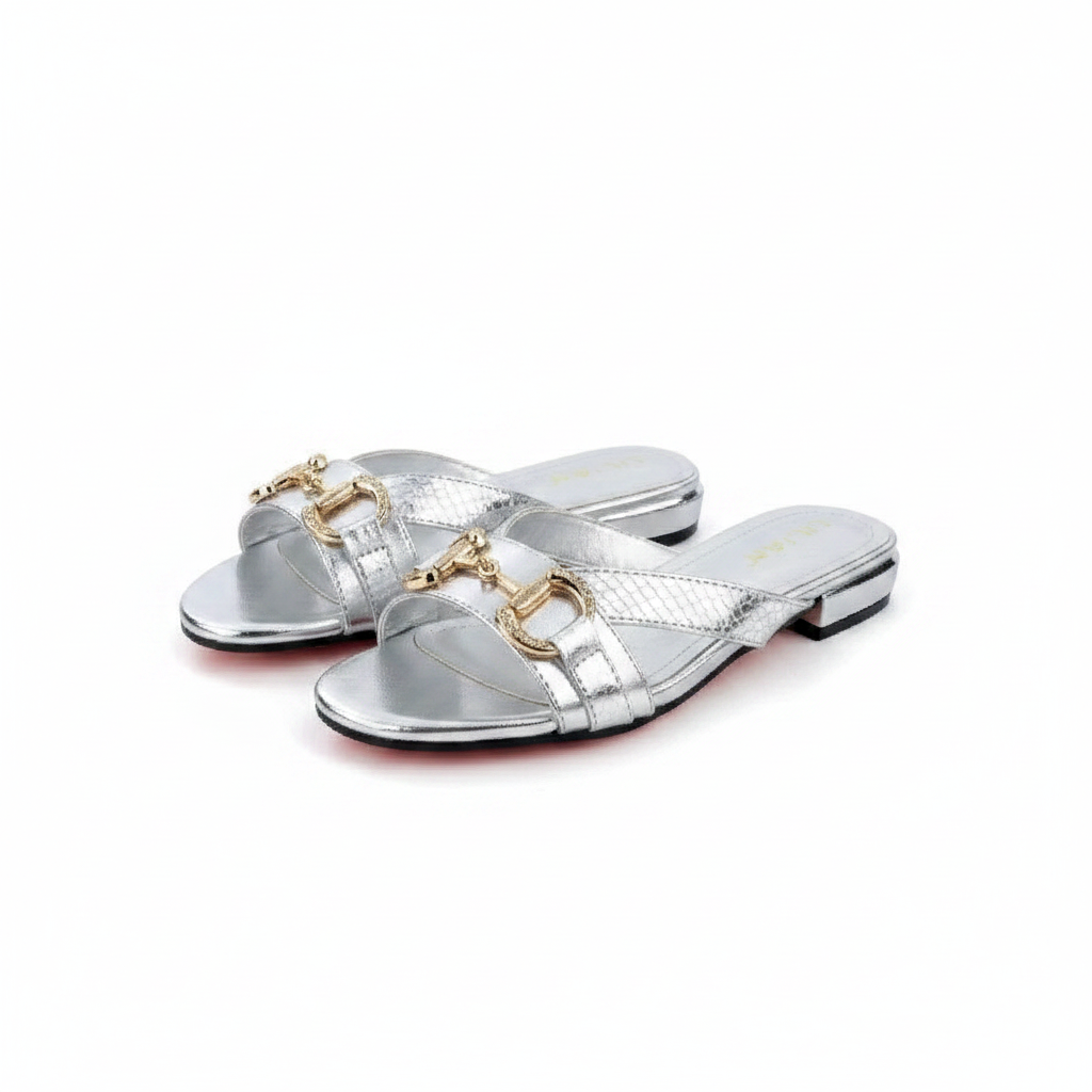 Ghost mannequin pair view of silver metallic horsebit flat slide sandals, left and right shoe