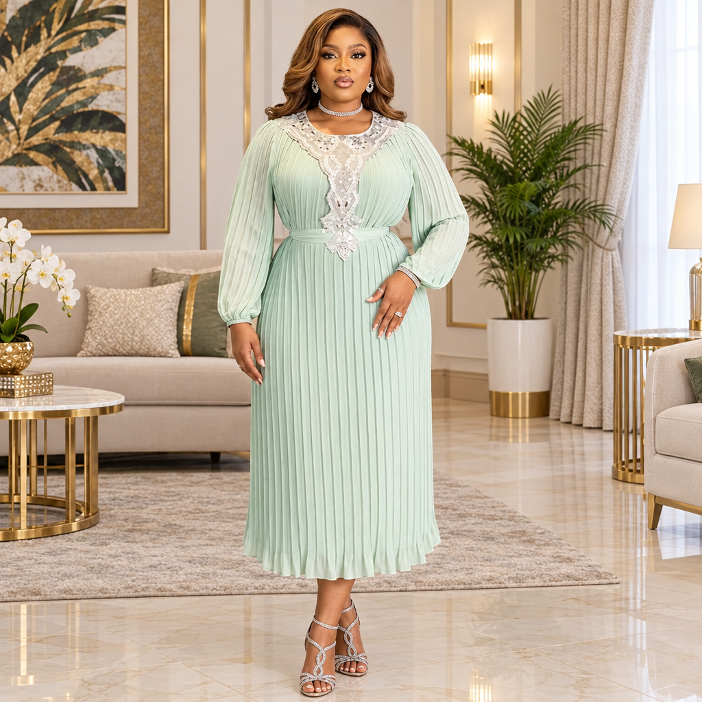 Woman wearing a mint green pleated midi dress with lace detail