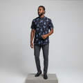 Nigerian male model wearing black butterfly and cherry print short-sleeved shirt