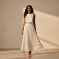Nigerian model wearing cream glitter pleated maxi skirt