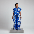 Nigerian female model wearing blue white adire sunflower long bubu gown