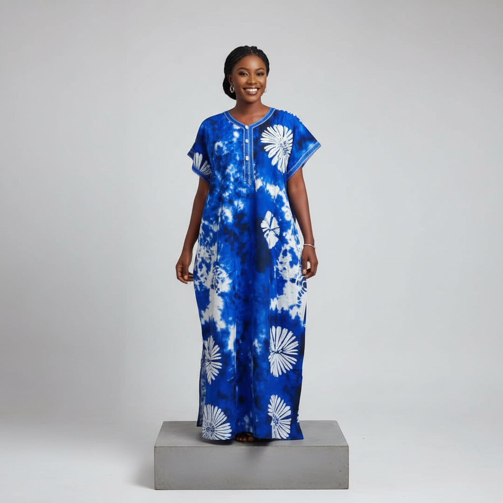 Nigerian female model wearing blue white adire sunflower long bubu gown