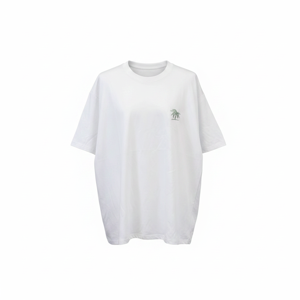 Ghost mannequin view of white oversized tee with small sage green palm tree crest on left chest