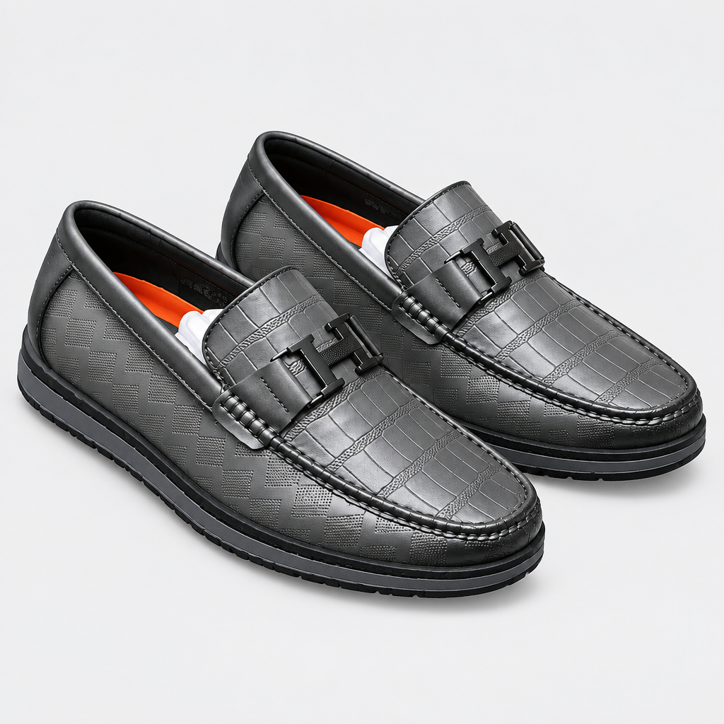 Black patterned buckle loafer pair on a clean background