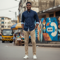 Young Nigerian male wearing navy micro print slim fit long sleeve shirt