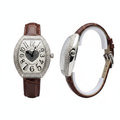 Women's silver oversized full diamond bezel crystal heart dial tonneau watch — ghost mannequin front and side view, brown leather strap