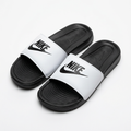 Pair of white graphic-strap slides with black ridged footbeds on white background