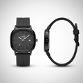 Black minimalist wristwatch shown from the front and side
