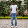 Nigerian male model wearing light blue baggy wide-leg denim jeans