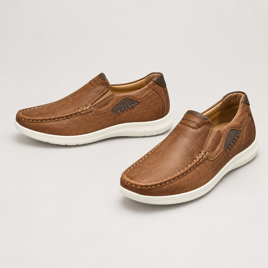 Pair of men's brown slip-on loafers with dark side panels and light soles