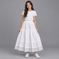 Child model wearing white tiered lace-hem skirt