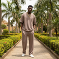 Nigerian male model wearing dusty brown matching co-ord set outdoors