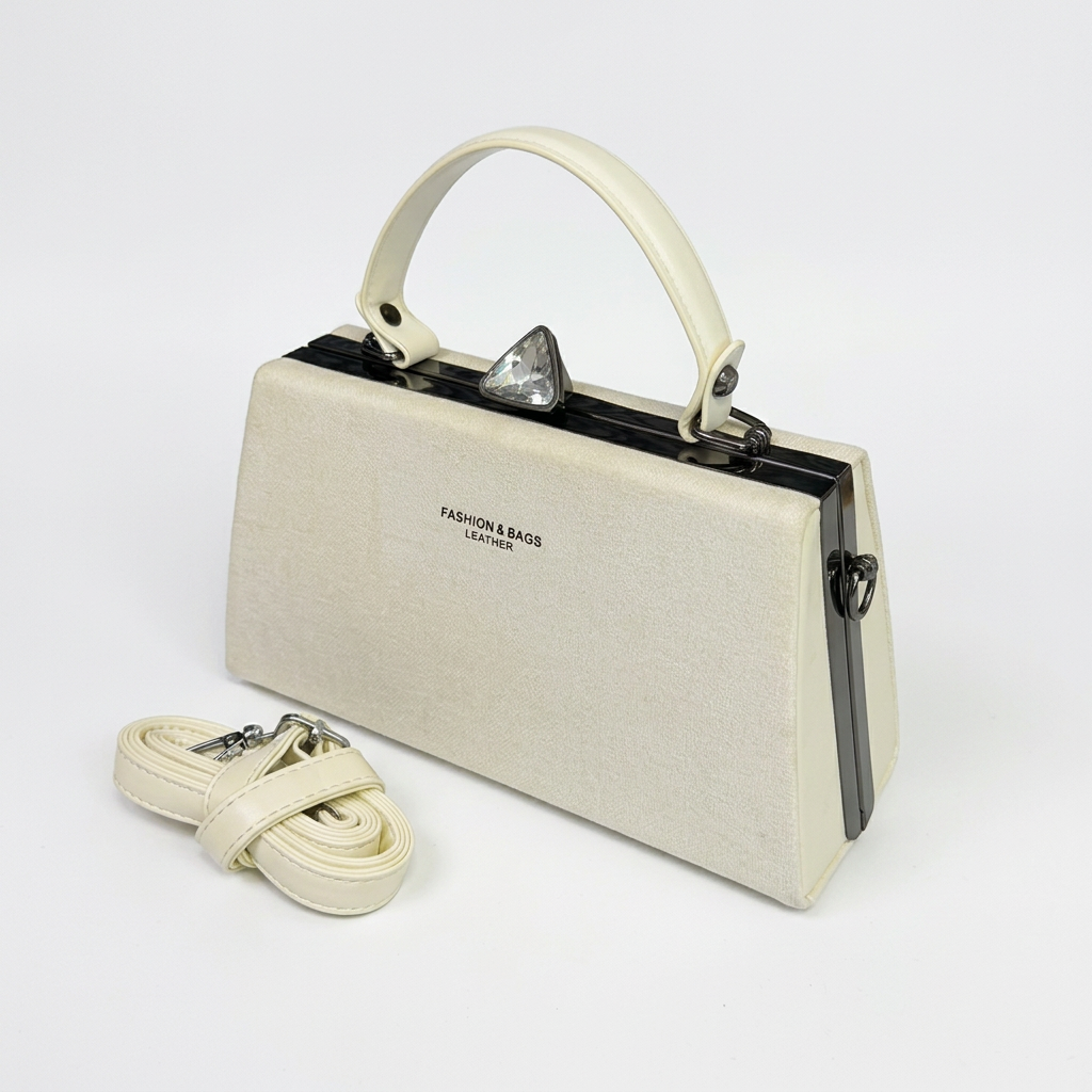Ivory structured top-handle handbag with matching detachable strap on a white background