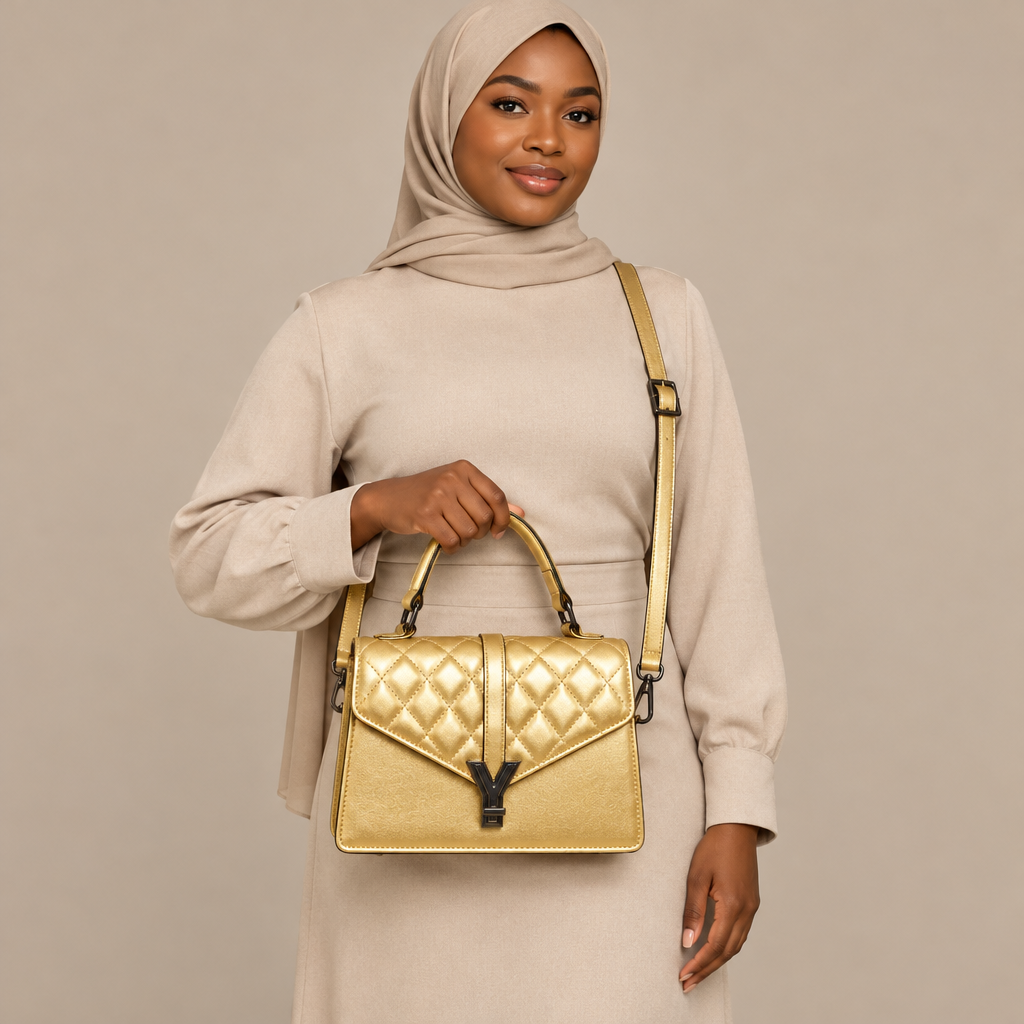 Adult woman carrying a metallic gold quilted handbag