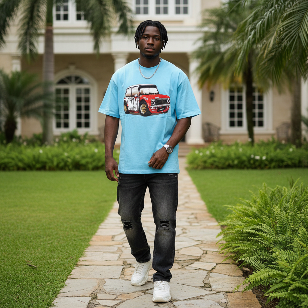 Nigerian male model wearing sky blue rally car graphic oversized tee – front view