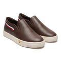 Pair of brown perforated slip-ons with off-white soles and striped heels on white